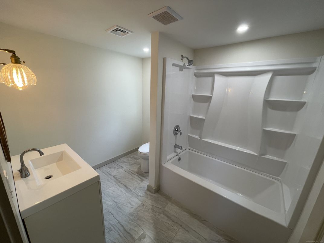 Bathroom, Dual Sink Vanities, Interior, Recessed Lighting, Wood Texture Flooring