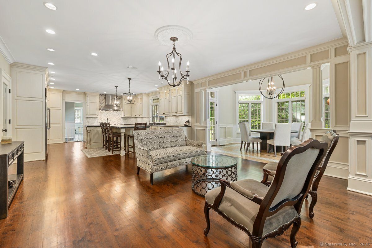Chandelier, Dining room, Interior, Kitchen, Living room, Pendant Lights, Recessed Lighting, Stainless Steel Appliances, Wood Texture Flooring