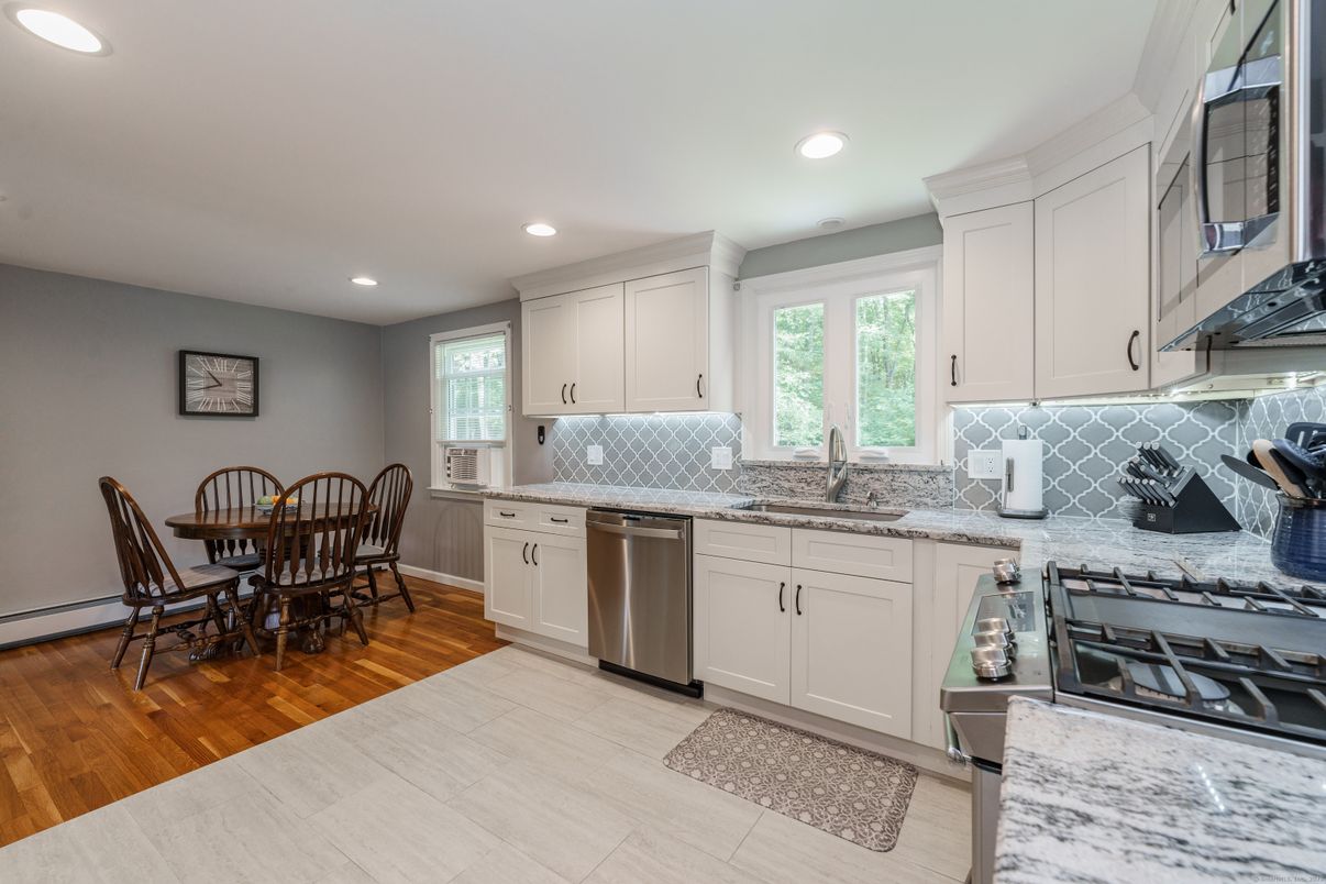 Dining room, Interior, Kitchen, Recessed Lighting, Stainless Steel Appliances, Wood Texture Flooring