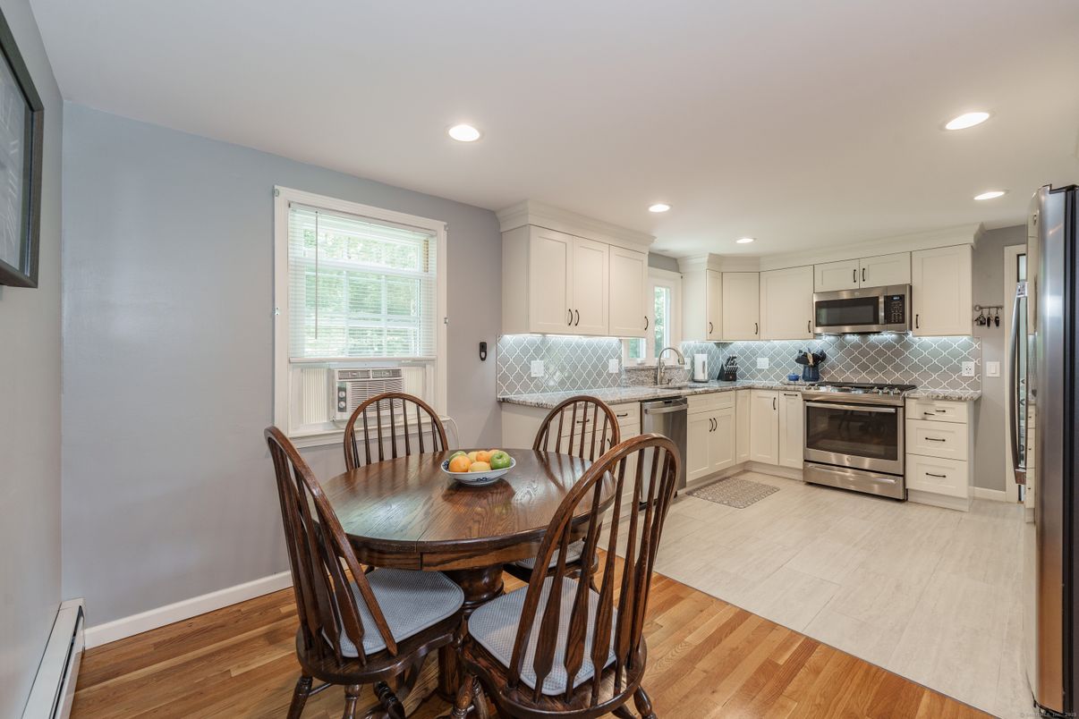 Dining room, Interior, Kitchen, Recessed Lighting, Stainless Steel Appliances, Wood Texture Flooring