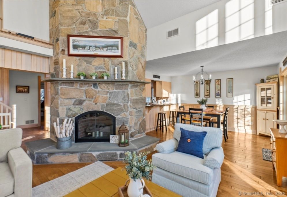 Chandelier, Dining room, Fireplace, Interior, Pendant Lights, Stone Walls, Wood Texture Flooring