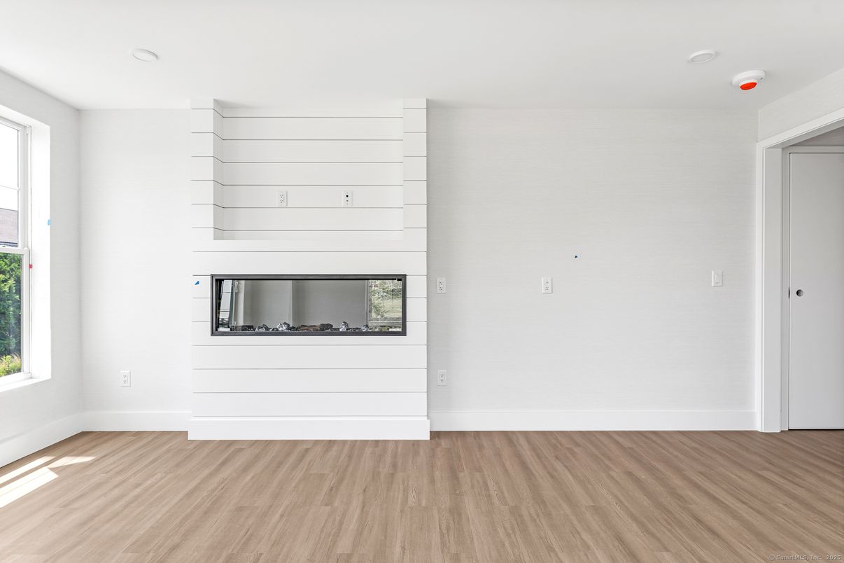 Empty room, Fireplace, Interior, Recessed Lighting, Wood Texture Flooring