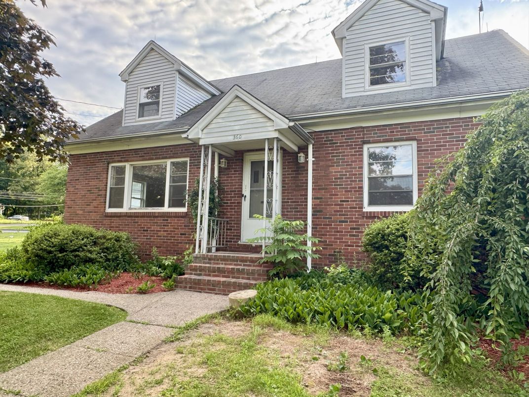 Exterior, Facade, Brick Facade, Cape Cod