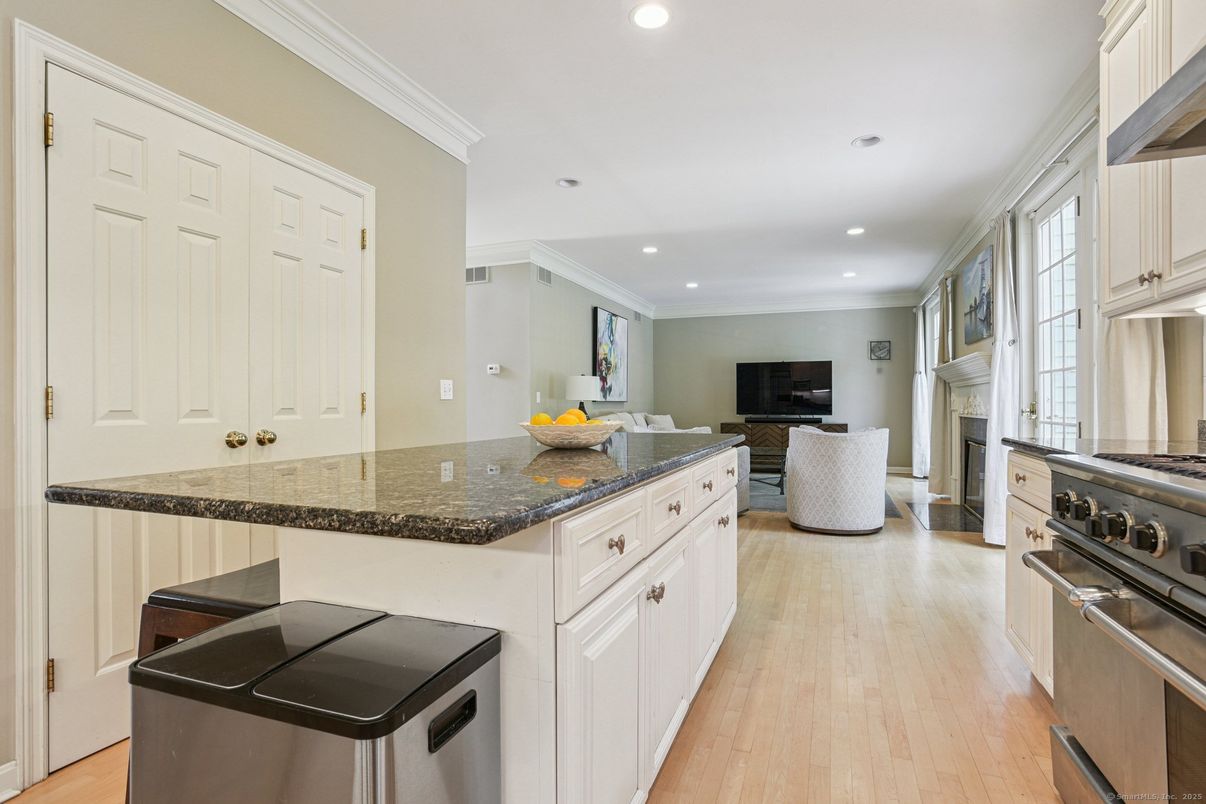 Fireplace, Interior, Kitchen, Recessed Lighting, Stainless Steel Appliances, Wood Texture Flooring