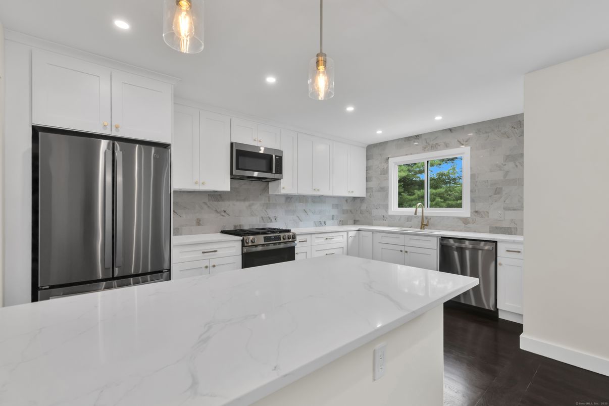 Interior, Kitchen, Marble Walls, Pendant Lights, Recessed Lighting, Stainless Steel Appliances, Wood Texture Flooring