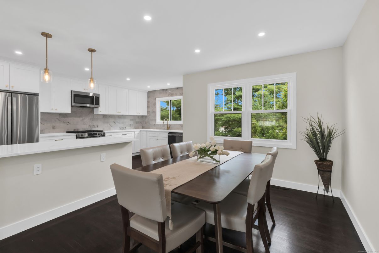 Dining room, Interior, Kitchen, Pendant Lights, Recessed Lighting, Stainless Steel Appliances, Wood Texture Flooring