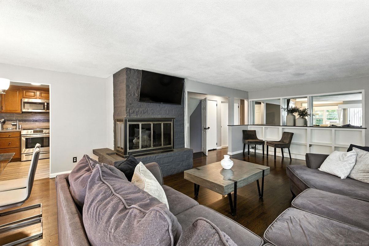 Dining room, Fireplace, Interior, Kitchen, Living room, Stainless Steel Appliances, Wood Texture Flooring