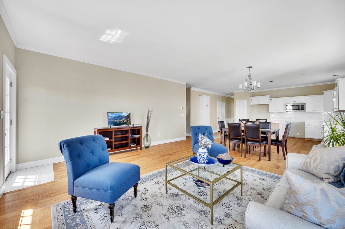 Chandelier, Dining room, Interior, Kitchen, Living room, Stainless Steel Appliances, Wood Texture Flooring