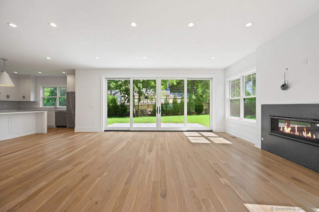 Empty room, Fireplace, Interior, Kitchen, Pendant Lights, Recessed Lighting, Wood Texture Flooring