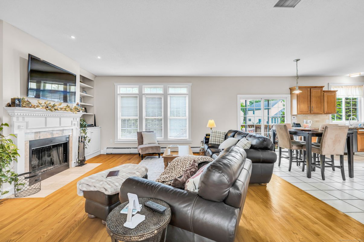 Dining room, Fireplace, Interior, Living room, Pendant Lights, Recessed Lighting, Wood Texture Flooring