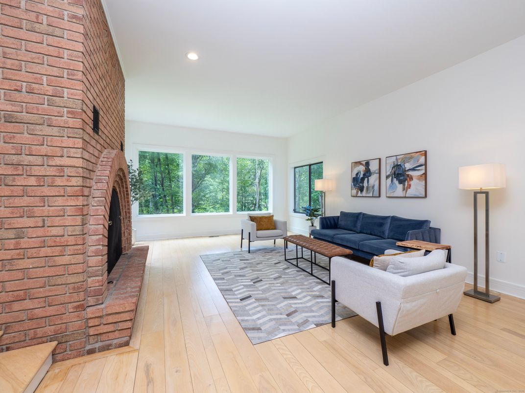 Fireplace, Interior, Living room, Recessed Lighting, Stone Walls, Wood Texture Flooring