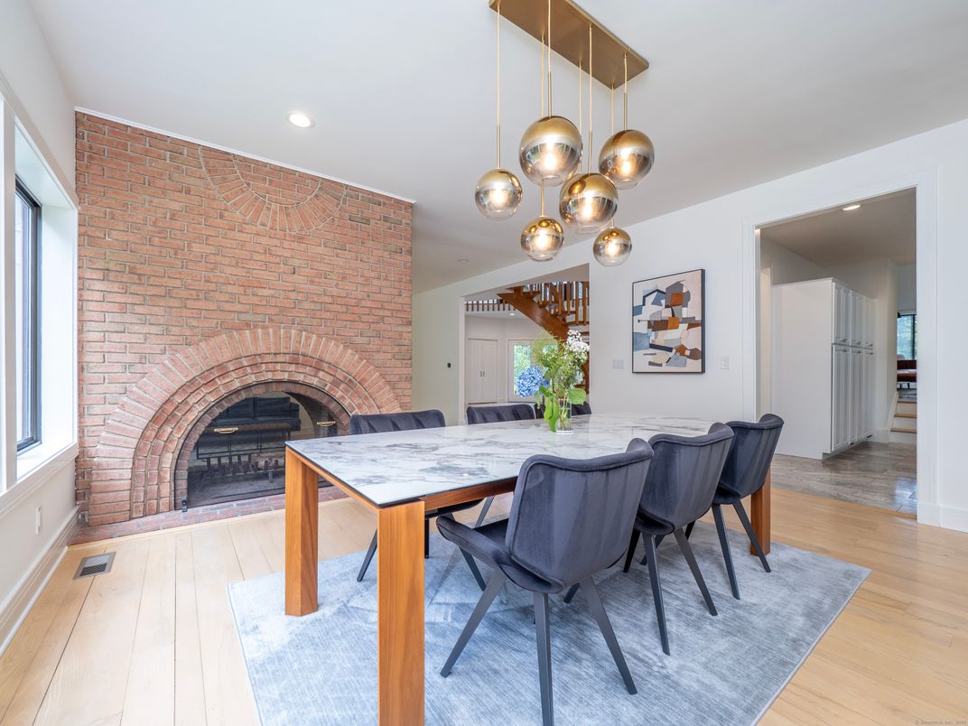 Dining room, Fireplace, Interior, Pendant Lights, Recessed Lighting, Stone Walls, Wood Texture Flooring