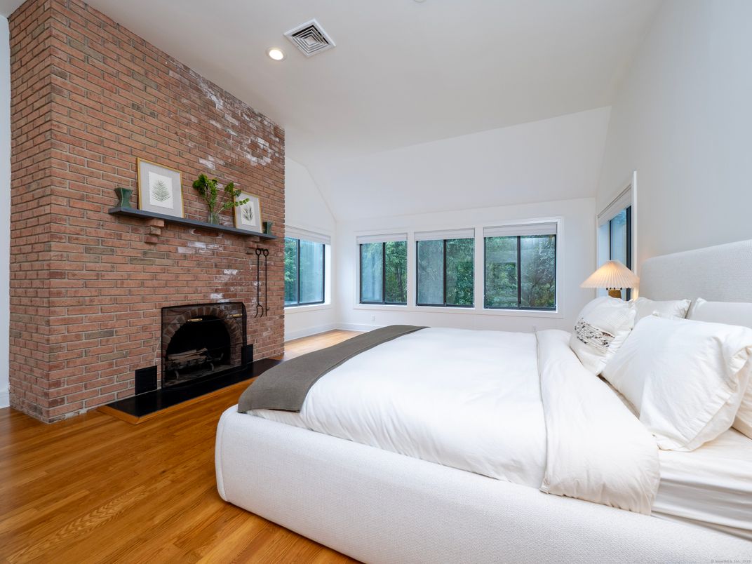 Bedroom, Fireplace, Interior, Recessed Lighting, Stone Walls, Wood Texture Flooring