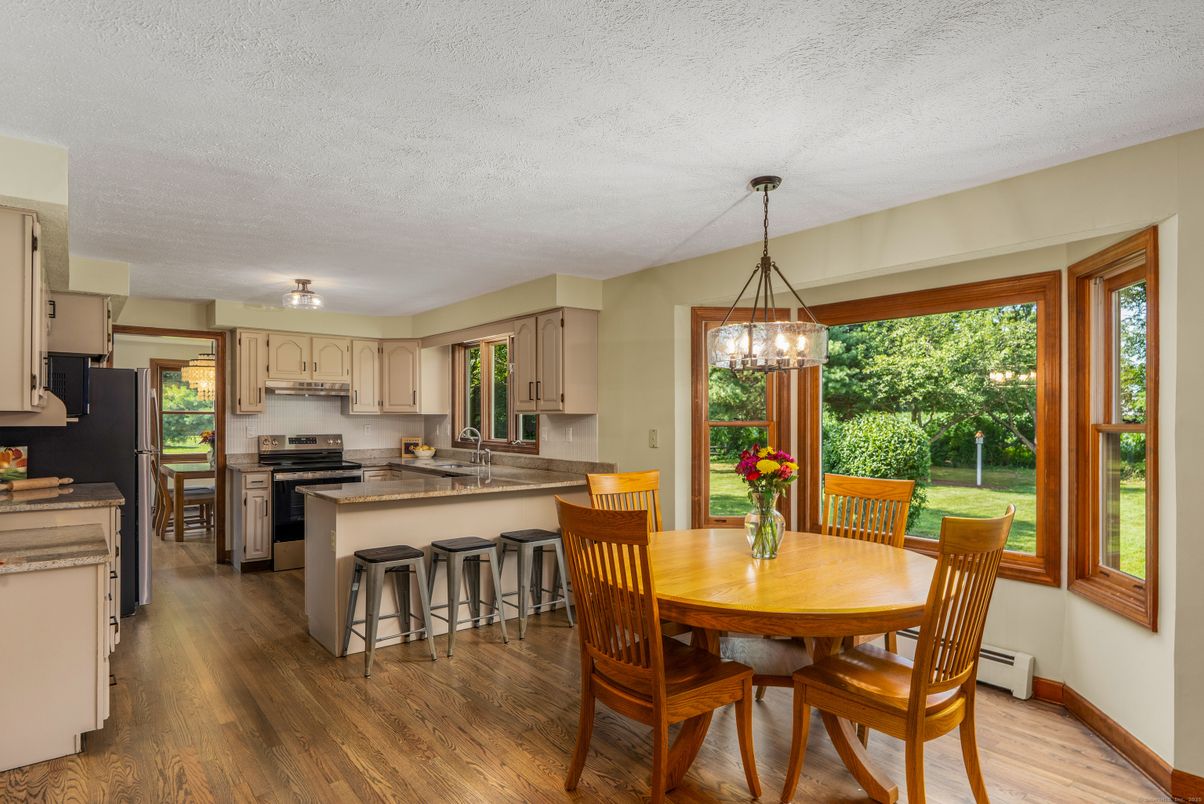 Dining room, Interior, Kitchen, Pendant Lights, Stainless Steel Appliances, Wood Texture Flooring