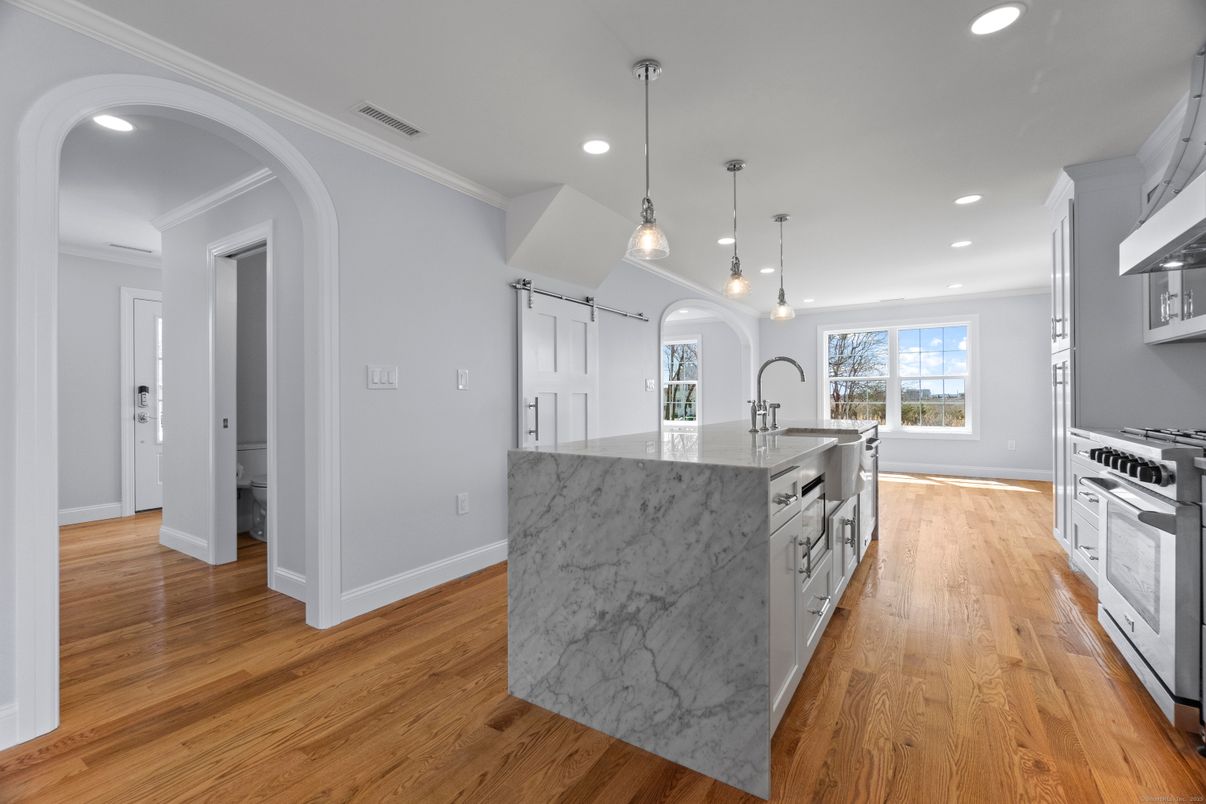 Interior, Kitchen, Pendant Lights, Recessed Lighting, Stainless Steel Appliances, Wood Texture Flooring