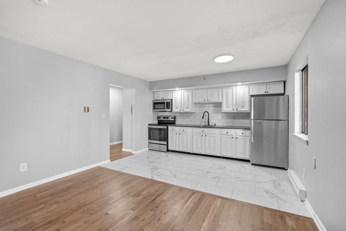 Interior, Kitchen, Marble, Recessed Lighting, Stainless Steel Appliances, Wood Texture Flooring