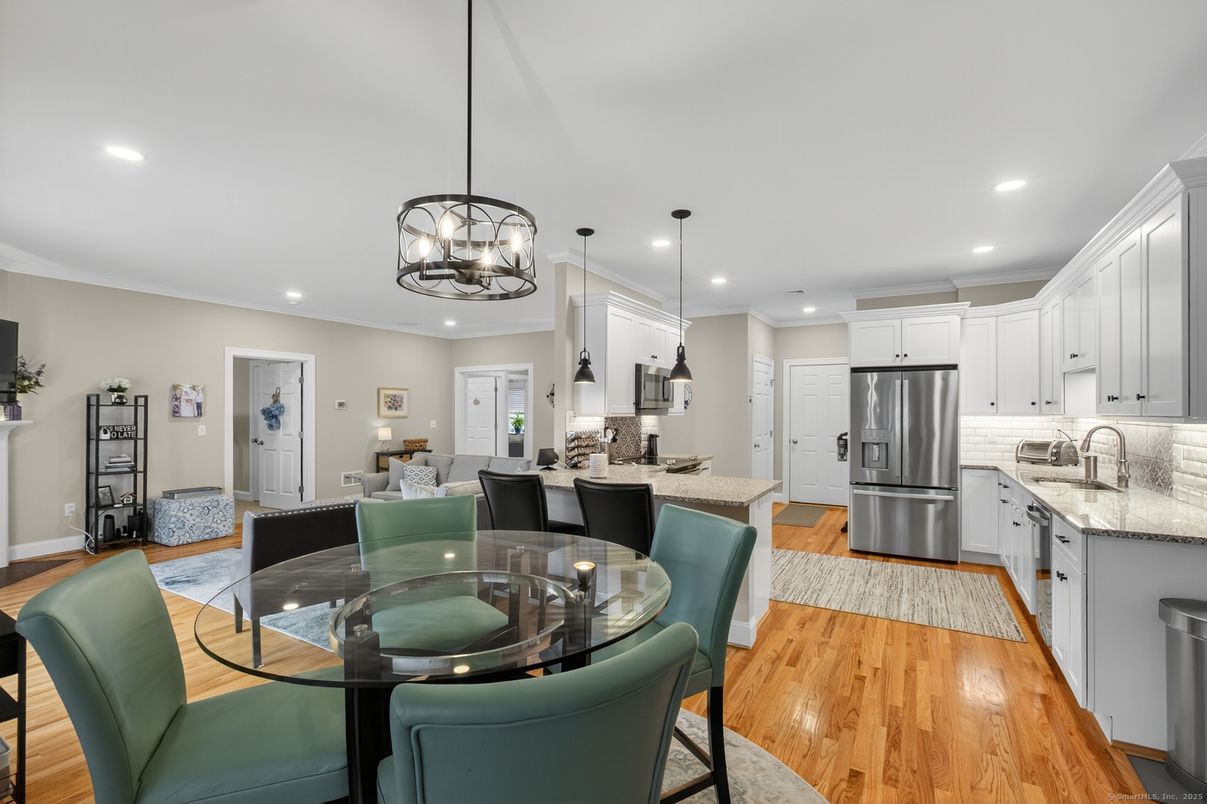 Chandelier, Dining room, Interior, Kitchen, Pendant Lights, Recessed Lighting, Stainless Steel Appliances, Wood Texture Flooring