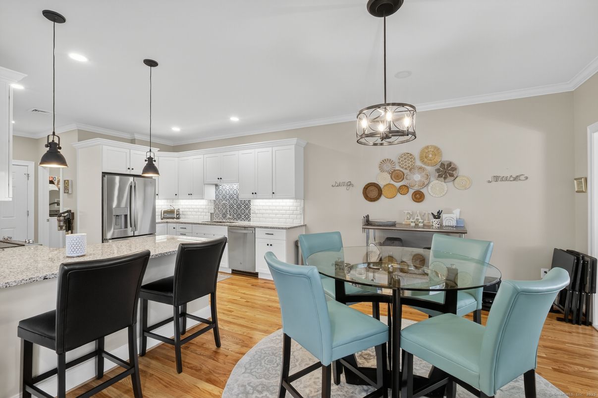 Dining room, Interior, Kitchen, Pendant Lights, Recessed Lighting, Stainless Steel Appliances, Wood Texture Flooring