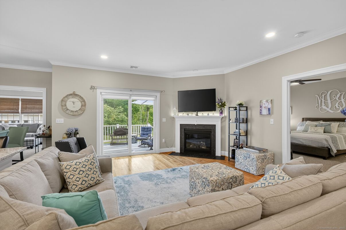 Bedroom, Fireplace, Interior, Living room, Recessed Lighting, Wood Texture Flooring