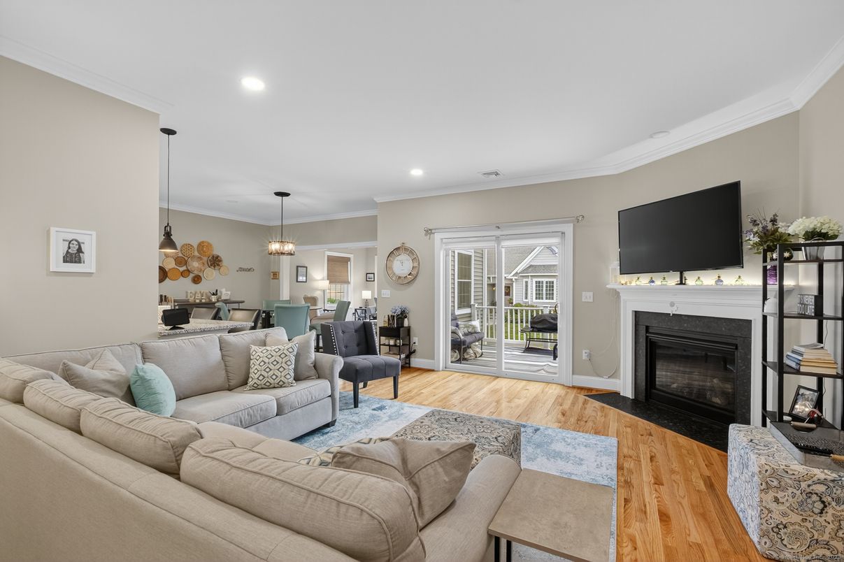 Dining room, Fireplace, Interior, Living room, Pendant Lights, Recessed Lighting, Wood Texture Flooring
