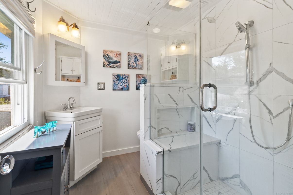Bathroom, Glass Shower, Interior, Marble Walls, Wood Texture Flooring