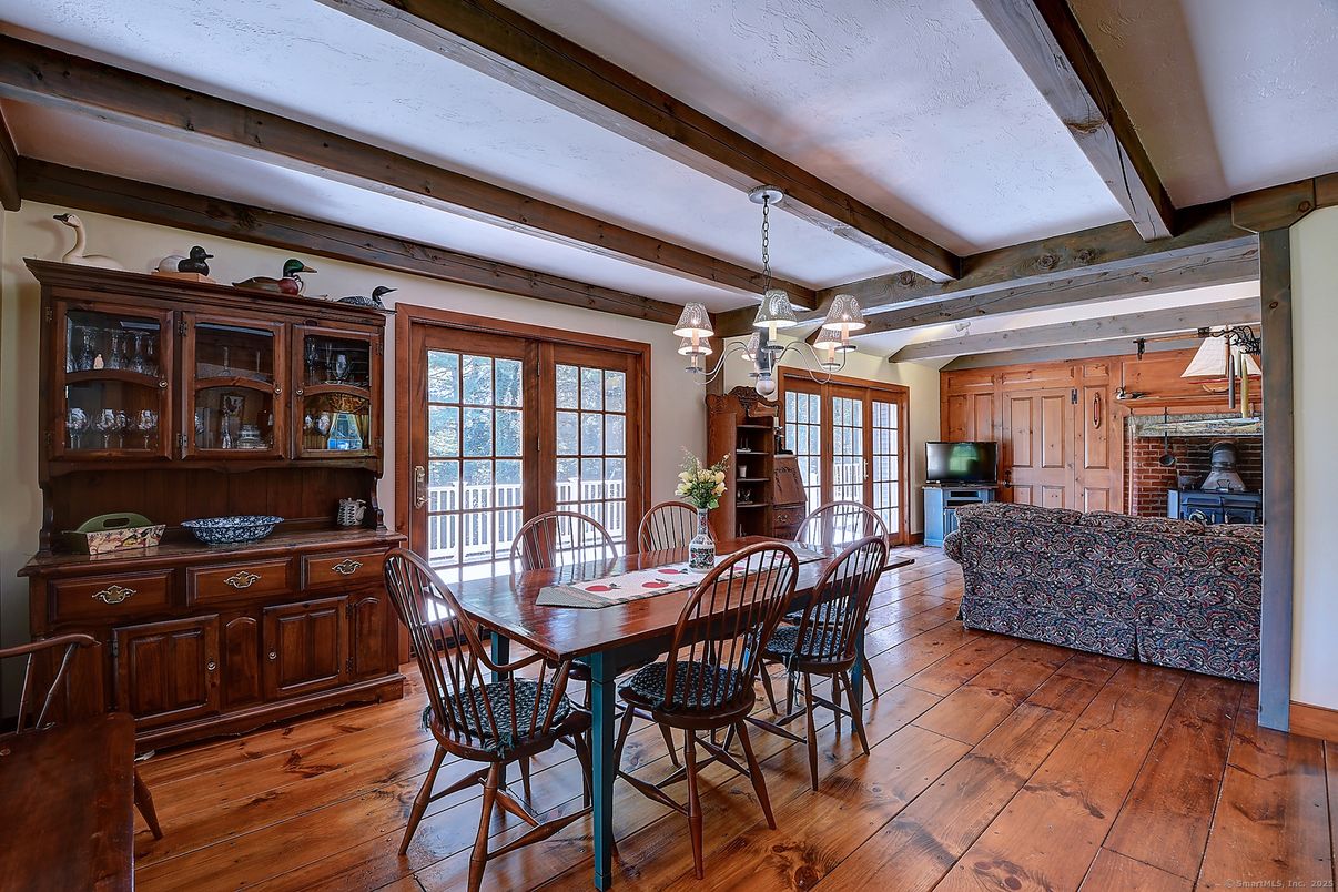 Chandelier, Dining room, Fireplace, Interior, Living room, Stone Walls, Wooden Beams, Wood Texture Flooring