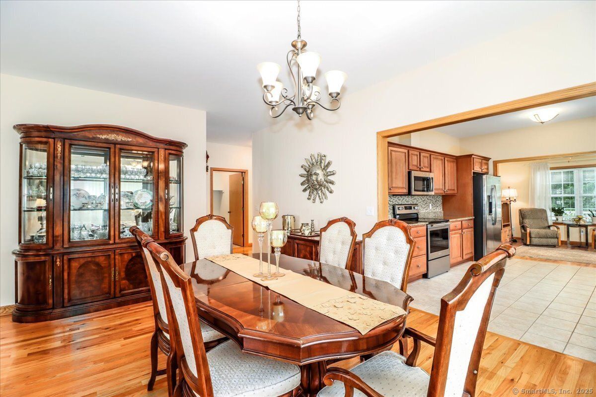 Chandelier, Dining room, Interior, Kitchen, Stainless Steel Appliances, Wood Texture Flooring