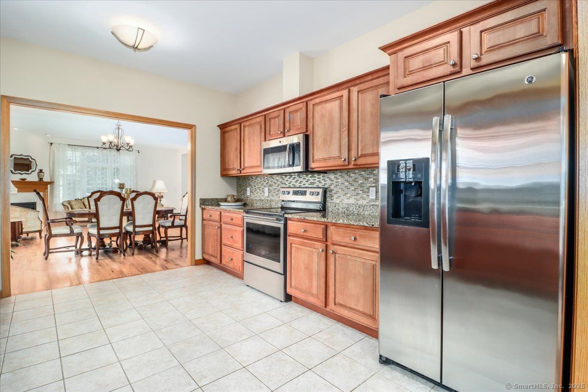 Chandelier, Dining room, Interior, Kitchen, Stainless Steel Appliances, Wood Texture Flooring