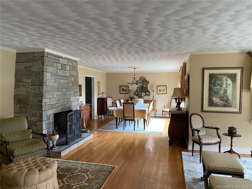 Chandelier, Dining room, Fireplace, Interior, Stone Walls, Wood Texture Flooring