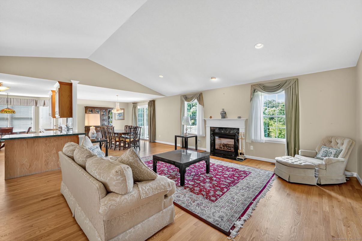 Dining room, Fireplace, Interior, Living room, Pendant Lights, Recessed Lighting, Wood Texture Flooring