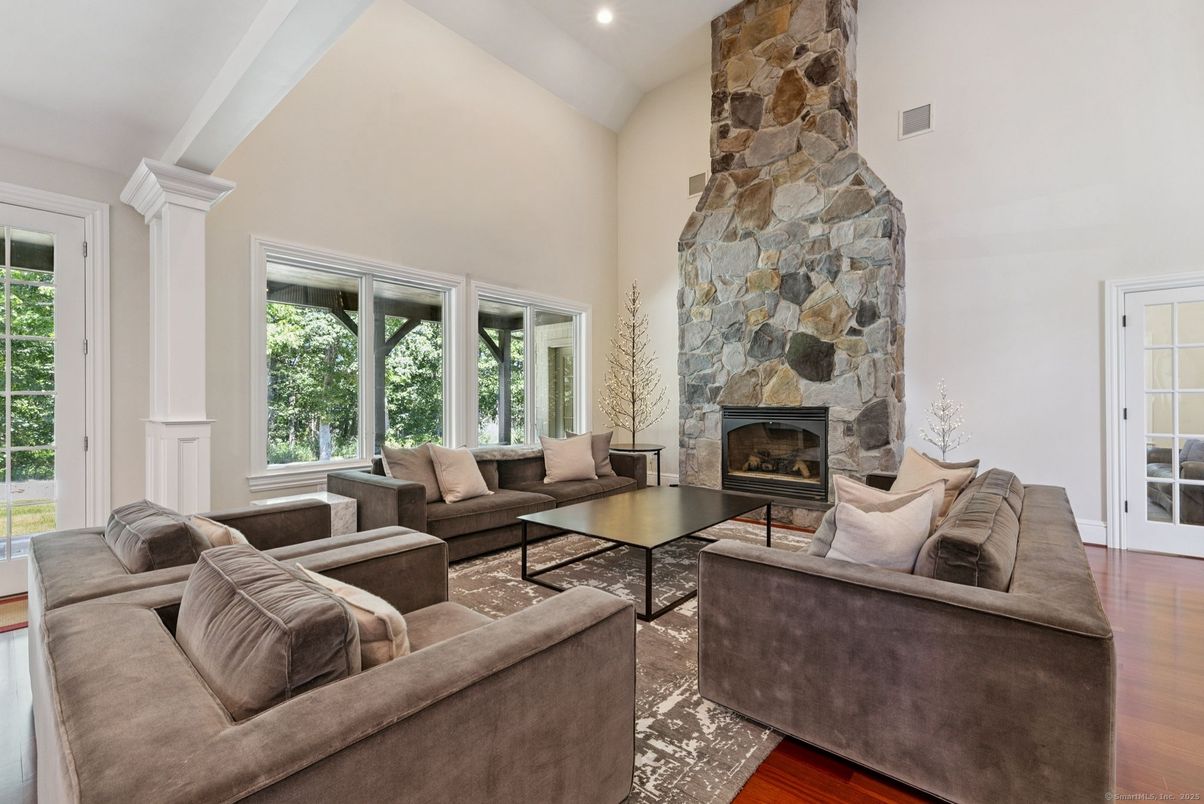 Fireplace, Interior, Living room, Recessed Lighting, Stone Walls, Wood Texture Flooring