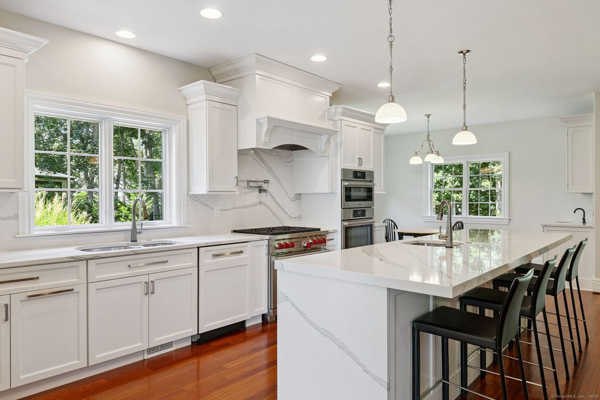 Interior, Kitchen, Marble Walls, Pendant Lights, Recessed Lighting, Stainless Steel Appliances, Wood Texture Flooring
