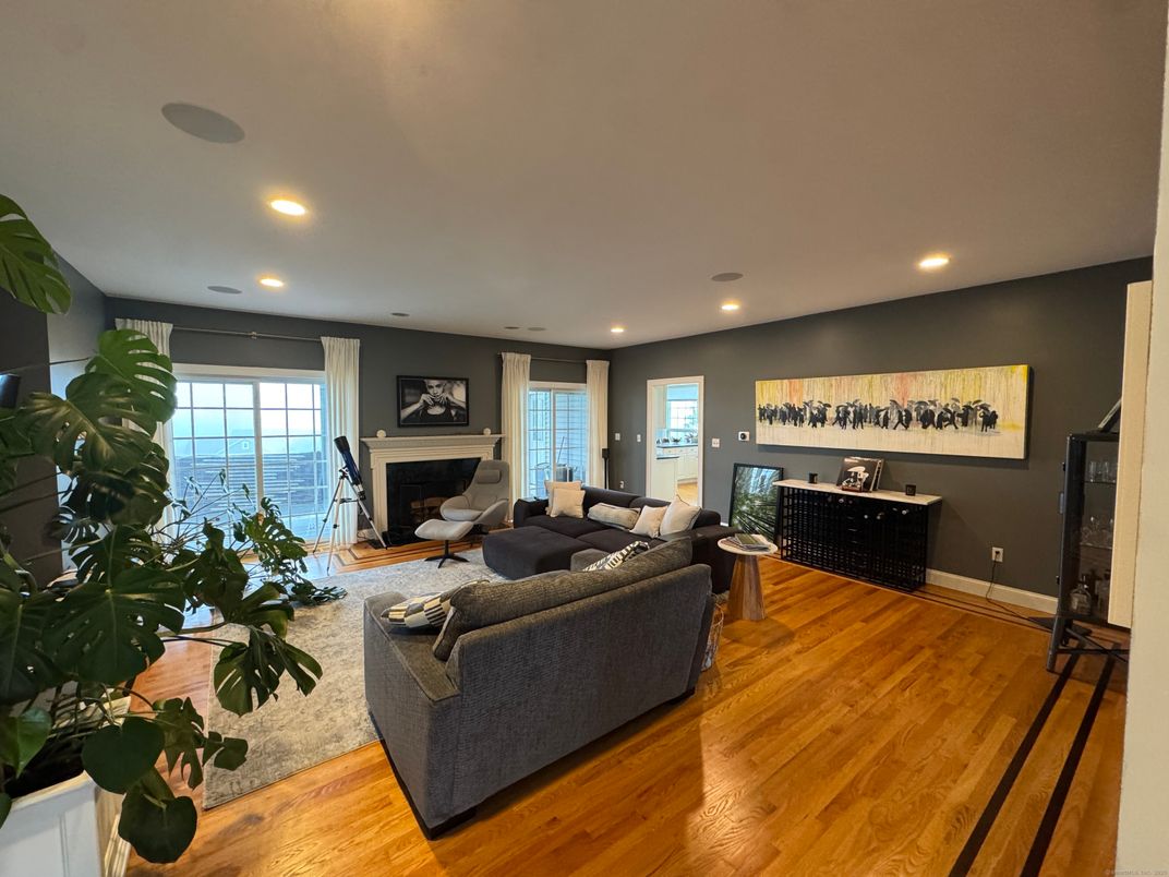 Fireplace, Interior, Living room, Recessed Lighting, Water, Wood Texture Flooring
