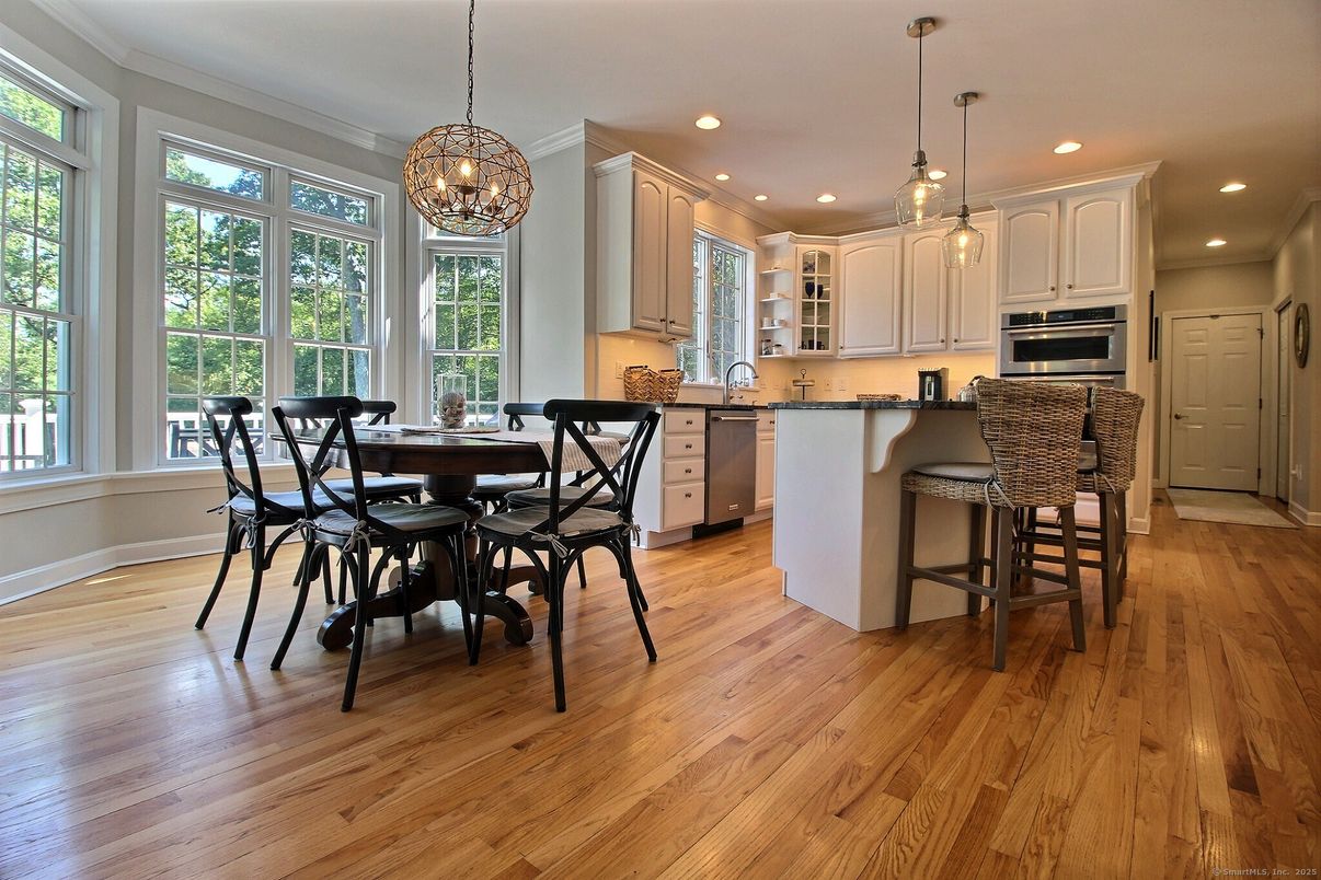 Chandelier, Dining room, Interior, Kitchen, Pendant Lights, Recessed Lighting, Stainless Steel Appliances, Wood Texture Flooring