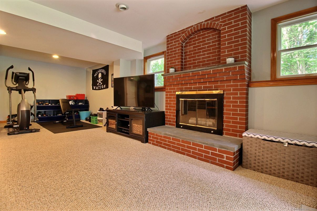 Fireplace, Fitness Equipment, Interior, Recessed Lighting, Stone Walls
