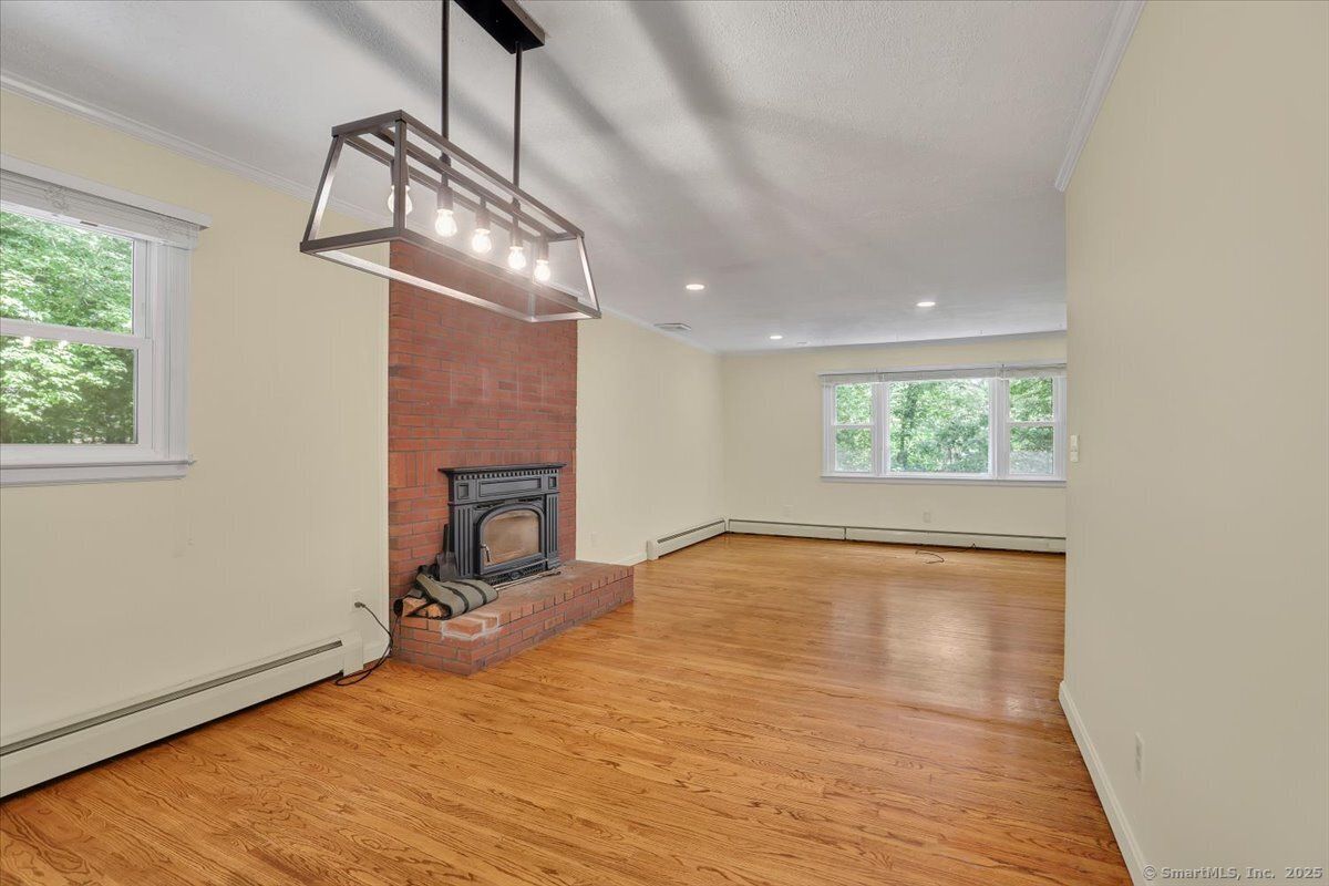 Empty room, Fireplace, Interior, Pendant Lights, Recessed Lighting, Wood Texture Flooring