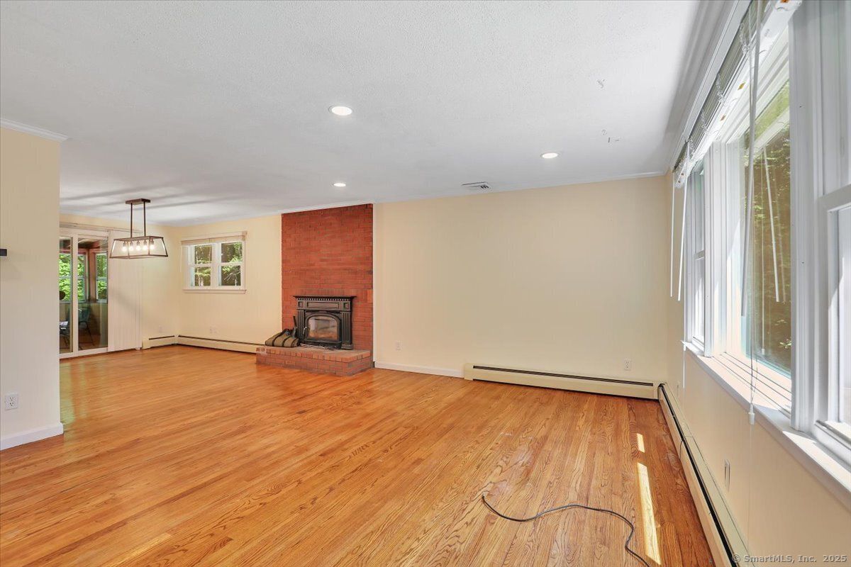 Empty room, Fireplace, Interior, Pendant Lights, Recessed Lighting, Wood Texture Flooring