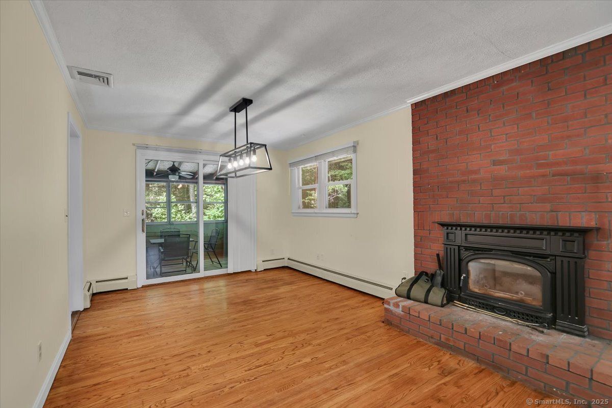 Empty room, Fireplace, Interior, Pendant Lights, Stone Walls, Wood Texture Flooring