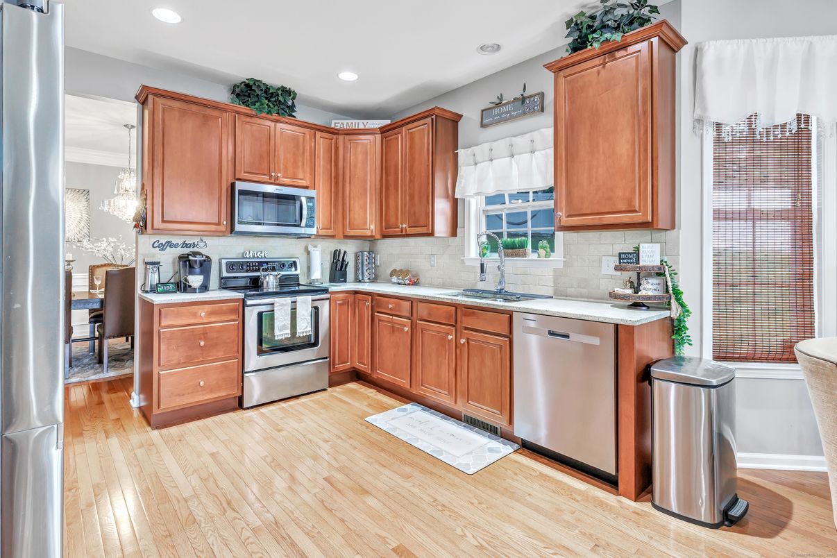 Dining room, Interior, Kitchen, Pendant Lights, Recessed Lighting, Stainless Steel Appliances, Wood Texture Flooring