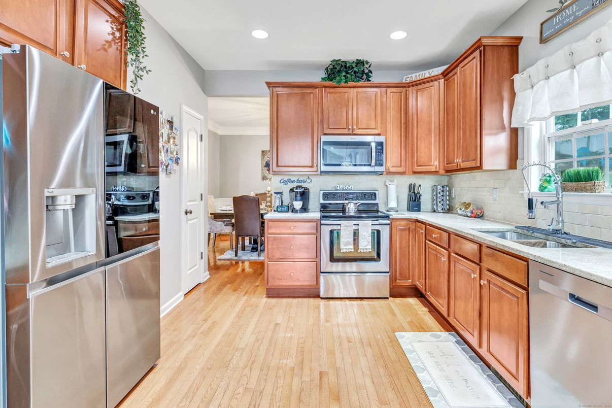 Dining room, Interior, Kitchen, Recessed Lighting, Stainless Steel Appliances, Wood Texture Flooring