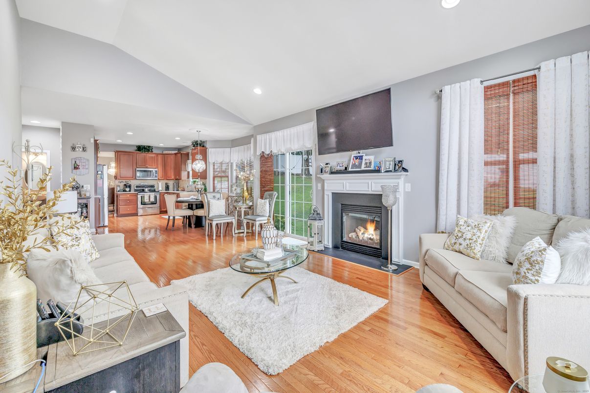 Dining room, Fireplace, Interior, Kitchen, Living room, Pendant Lights, Recessed Lighting, Stainless Steel Appliances, Wood Texture Flooring
