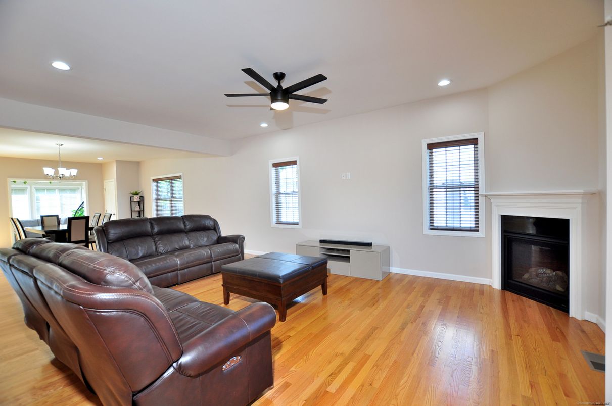 Chandelier, Dining room, Fireplace, Interior, Living room, Recessed Lighting, Wood Texture Flooring