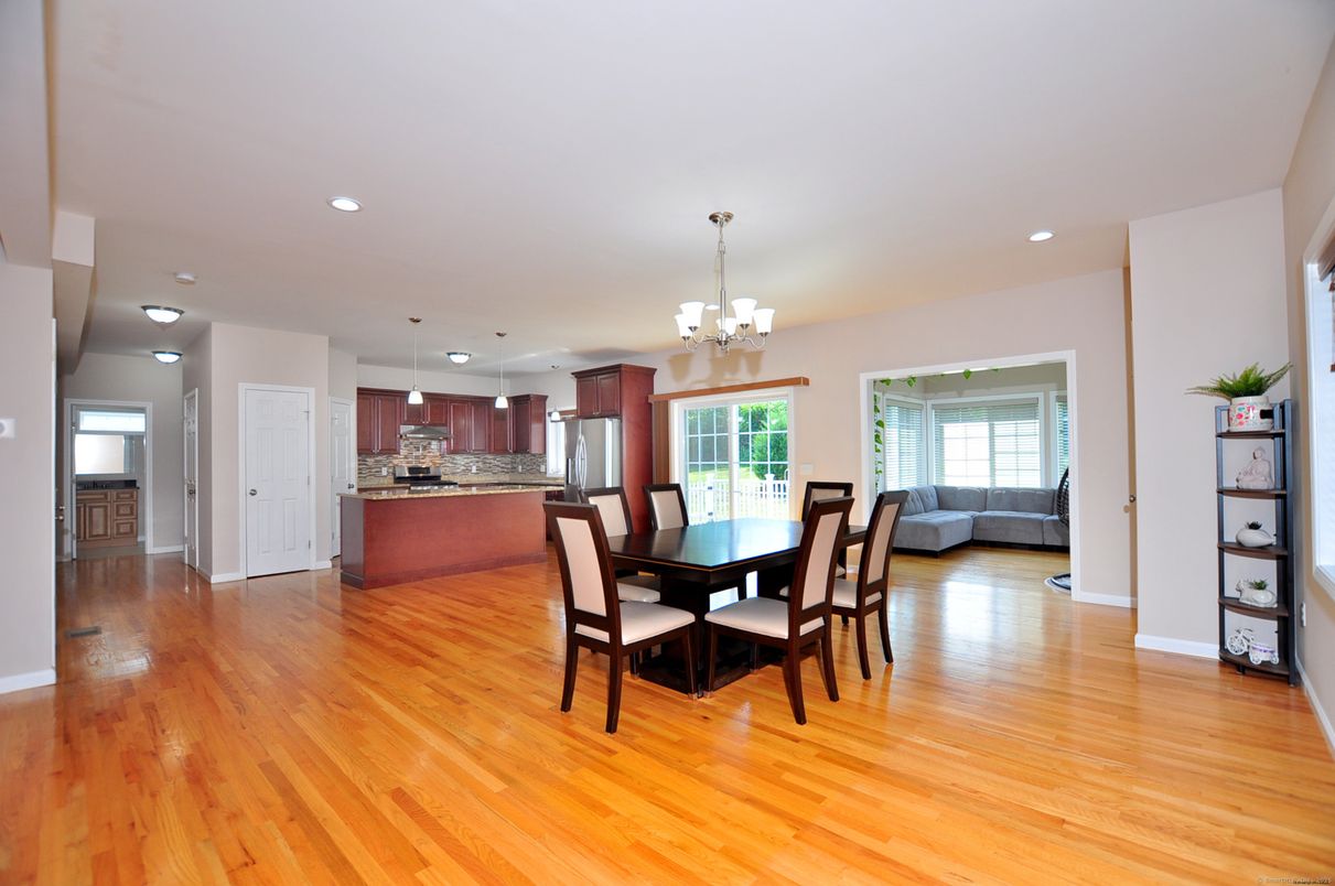 Chandelier, Dining room, Interior, Kitchen, Pendant Lights, Recessed Lighting, Stainless Steel Appliances, Wood Texture Flooring