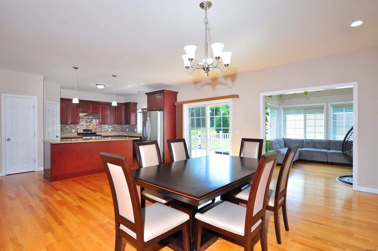 Chandelier, Dining room, Interior, Kitchen, Pendant Lights, Recessed Lighting, Stainless Steel Appliances, Wood Texture Flooring