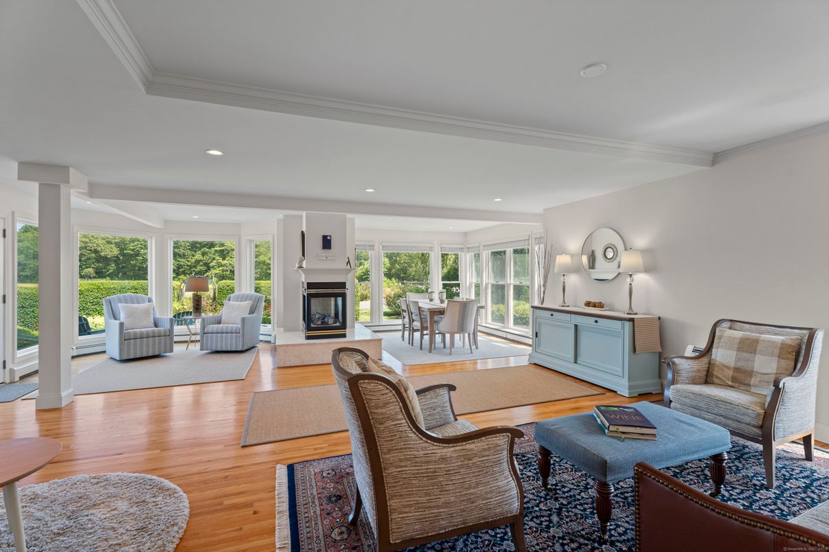 Dining room, Fireplace, Interior, Living room, Recessed Lighting, Wood Texture Flooring