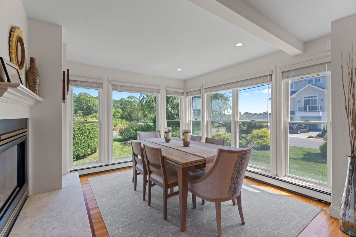 Dining room, Fireplace, Interior, Recessed Lighting, Sun Room, Wood Texture Flooring