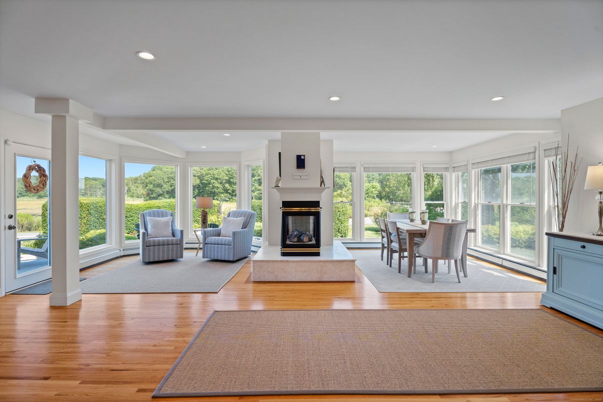 Dining room, Fireplace, Interior, Living room, Recessed Lighting, Wood Texture Flooring