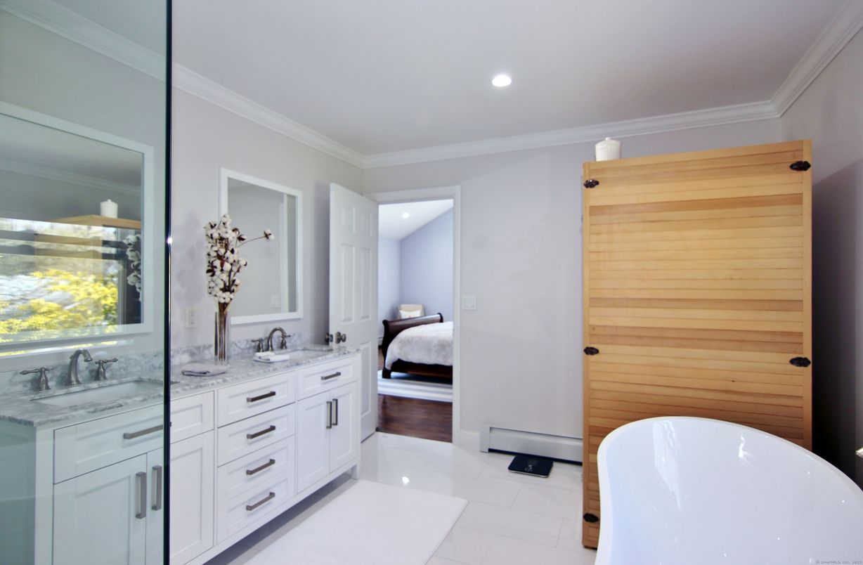 Bathroom, Bedroom, Dual Sink Vanities, Free Standing Baths, Interior, Recessed Lighting, Wood Texture Flooring, Wooden Walls