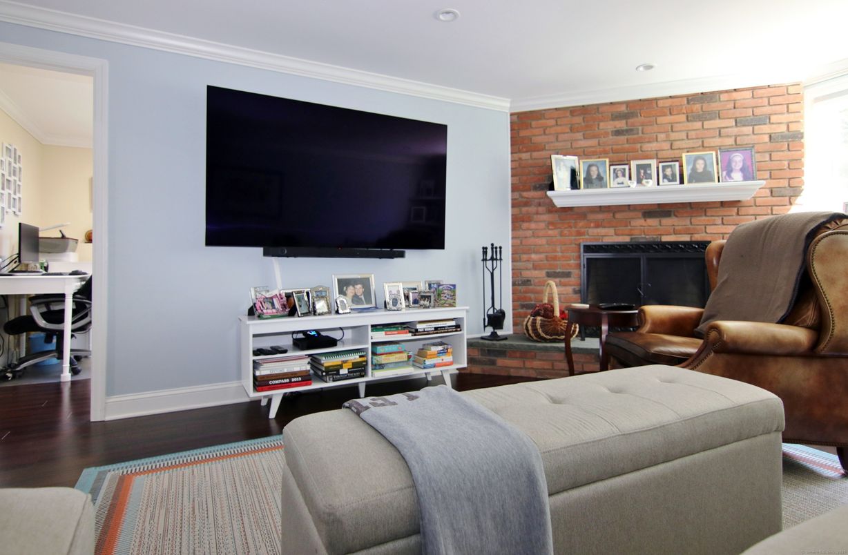 Fireplace, Interior, Living room, Recessed Lighting, Stone Walls, Wood Texture Flooring