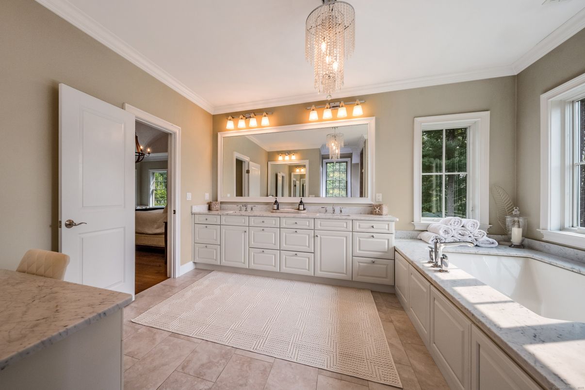 Bathroom, Chandelier, Dual Sink Vanities, Interior, Wood Texture Flooring
